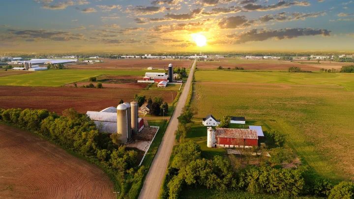Farm land with the sun setting