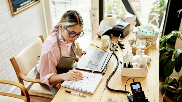 Business owner working at her desk at home